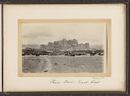 Phari Fort seen from the east with houses and pack animals surrounding it, Tibet