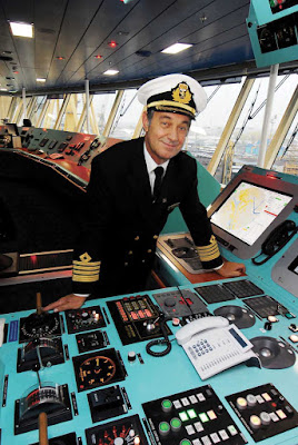 Captain Wright on the bridge of Queen Victoria. 