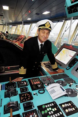 Captain Wright on the bridge of Queen Victoria. 