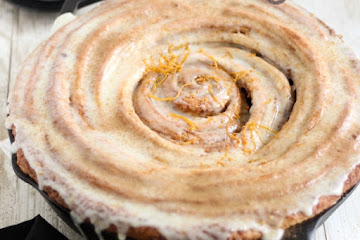Giant Skillet Cinnamon Roll with Orange Cream Cheese Glaze