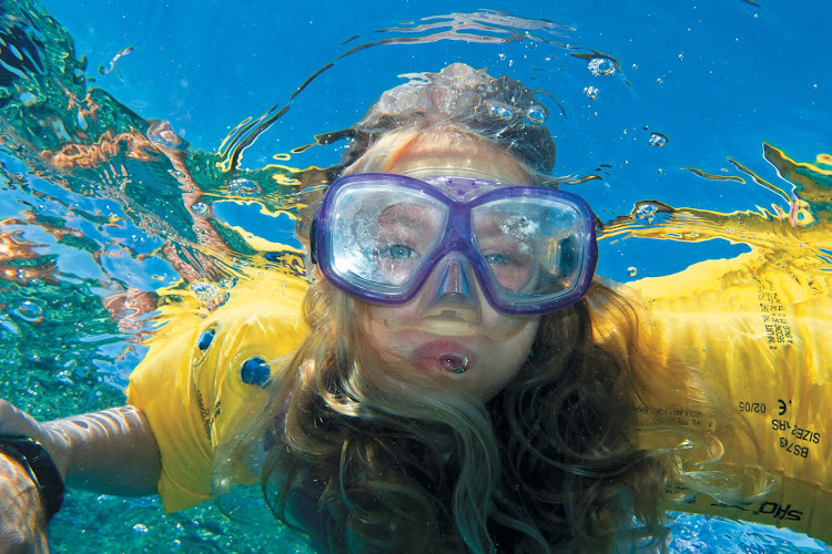 Snorkeling through turquoise reefs is one way the Paul Gauguin introduces young travelers to the natural wonders of French Polynesia.