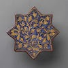 Star-shaped tile with a stylized flowering plant