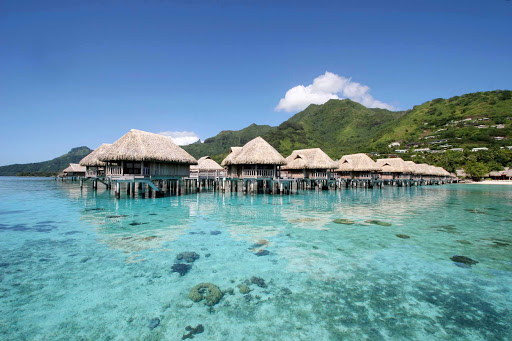 Overwater bungalows line the reef and beach at Sofitel Ia Ora on Mo'orea.