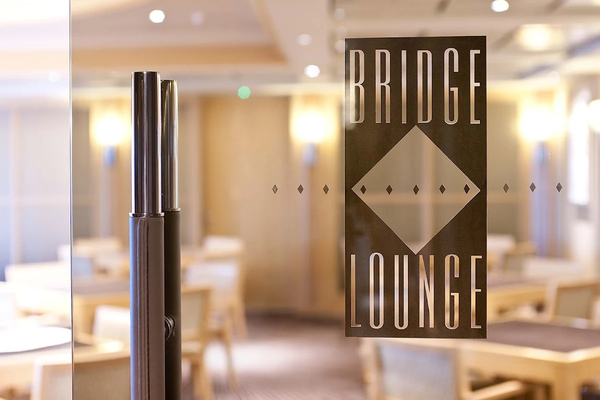 Enrichment-Entertainment-Bridge-Lounge-on-Crystal-Symphony - The chic Bridge Lounge on the Crystal Symphony is the perfect place to play cards or relax with a mimosa.