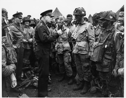 General Eisenhower speaks with paratroopers before the first assault of the Normandy invasion. June 5, 1944.