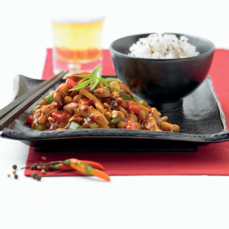 Silk Harvest's kung pao chicken served with a hint of chili and steamed rice on your Celebrity cruise.