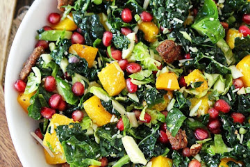 Kale and Brussels Sprouts Salad with Butternut Squash, Pomegranate, and Candied Pecans