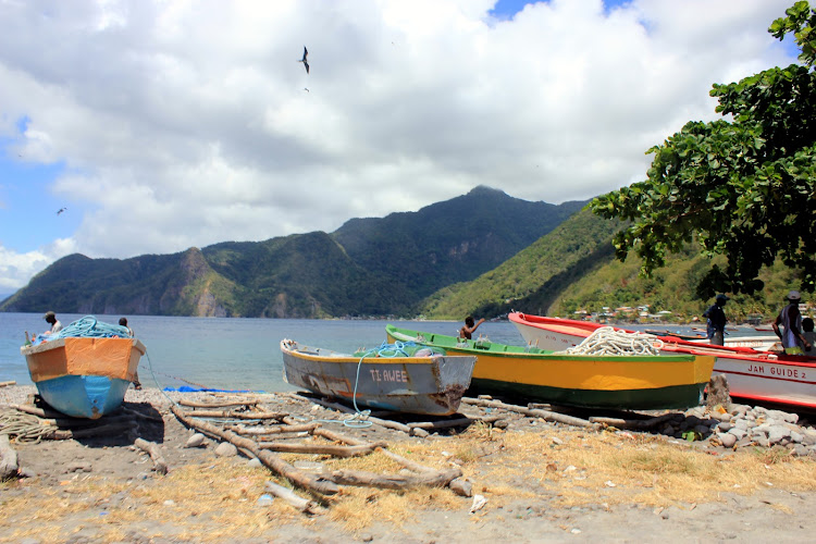 The picturesque town of Soufriere in Dominica - colorful boats and hot springs abound.