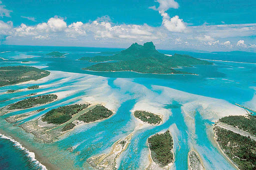 An aerial view of Bora Bora shows the miles of barrier reef surrounding the island.