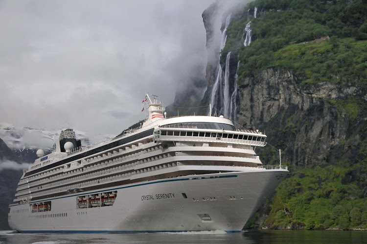 Crystal Serenity sails by lovely misty waterfalls in North Cape Geiranger, Norway.
