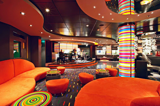 MSC-Fantasia-Manhattan-Bar - An ode to jazz, the Manhattan Bar on MSC Fantasia is a stylish lounge where guests can listen to live music and sip fine whiskies, cognac and top-shelf liquors. 
