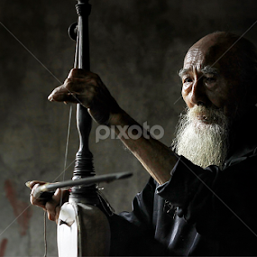 Pemain Rebab by Pujo Tri Susanto - People Musicians & Entertainers