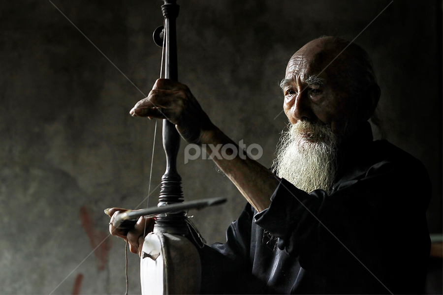 Pemain Rebab by Pujo Tri Susanto - People Musicians & Entertainers