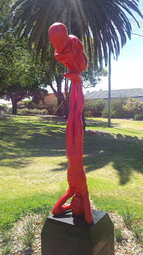 Red Headstand Sculpture