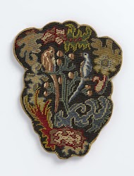 Vuurscherm van linnen, gespannen over geschulpt, houten(?) frame, aan de voorkant geborduurd met veelkleurige wol en aan de achterkant bedrukt met een brullende leeuw