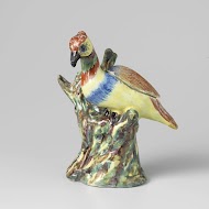 Vogel op boomstam van faience