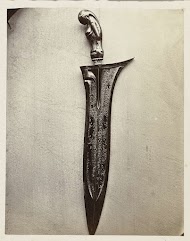 Kris (keris) ornamented with a veiled Durga, acting as the goddess of the netherworld, ready for frightening a victim to death; probably inscribed with a Koran verse in Arabic script. Garut, Garut disctrict, West Java province, 18th century.