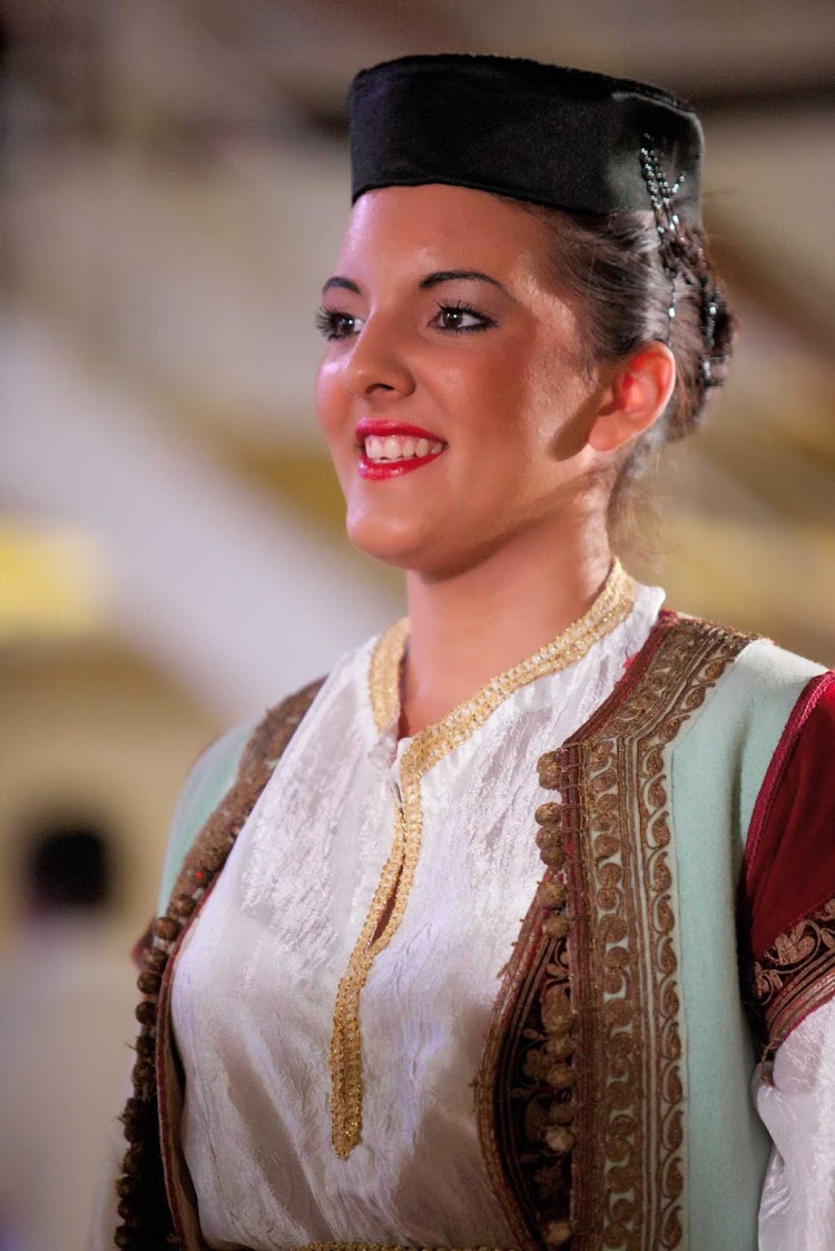 A performer in traditional garb during a show on an  Azamara cruise.