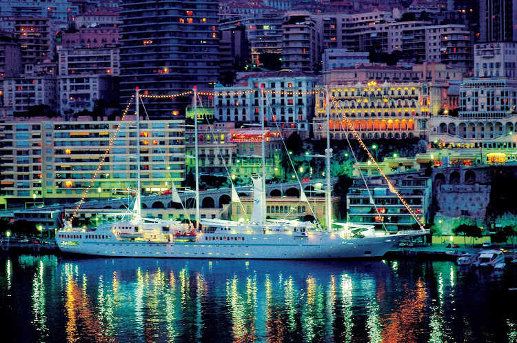 Windstar's Wind Surf gleams at night in the Monte Carlo harbor.