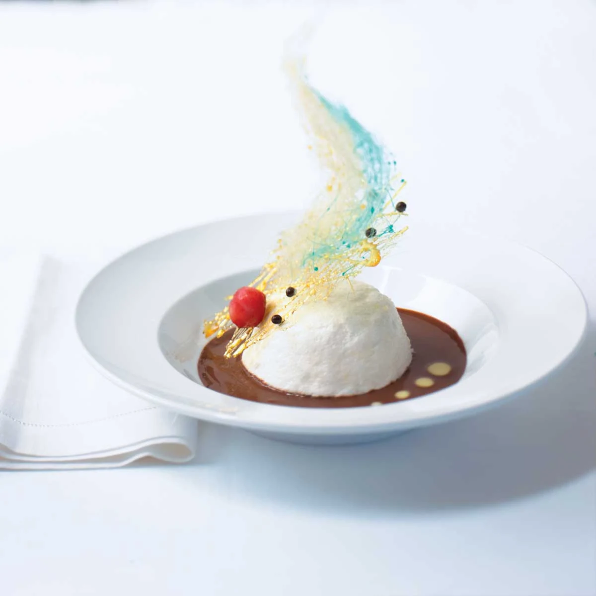 Blu Chocolate Floating Island with Orange Blossom Creme Anglaise - Can a dessert be a work of art? The Blu Chocolate Floating Island with Orange Blossom Crème Anglaise at Celebrity's Blu restaurant.