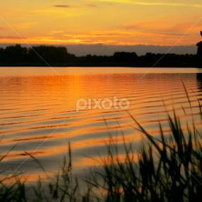 When the sun goes down by Joop Korrel - Landscapes Waterscapes