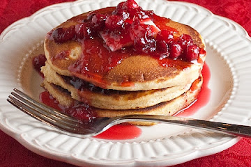 Eggnog Pancakes with Canberry-Orange Syrup