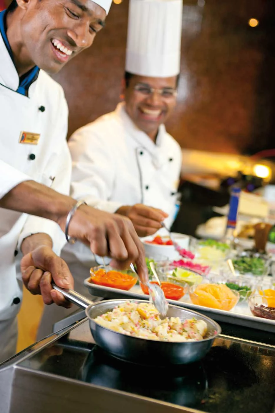 Carnival-Cruise-Lines-dining-Chefs-Table-cooks - Revel in a multicourse dinner prepared by the master chefs of Chef's Table during your Carnival cruise.