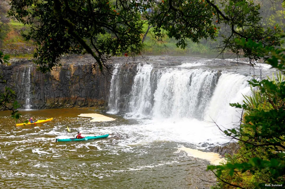 Haruru_Falls_Bay_of_Islands - The Haruru Falls were created by an ancient lava flow. You can reach the falls by road, walking track or sea kayak from historic Waitangi in the Bay of Islands. The walking track includes native forest and a boardwalk through a tidal mangrove forest. Local guided kayak tours offer full tuition and an informative commentary along the way.